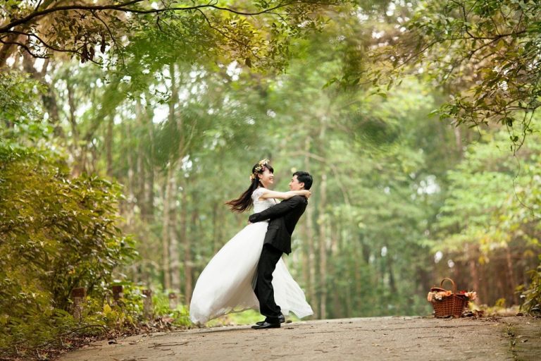 Wedding Photography - Wedding Phot of couple embracing in nature on dirt road
