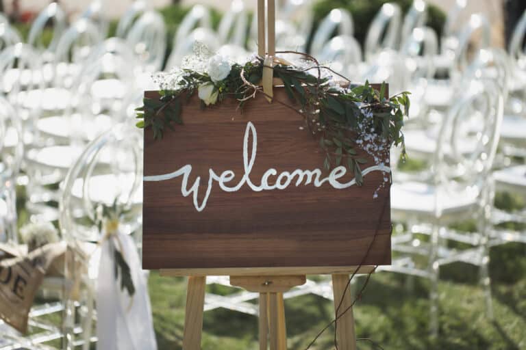 Love was in the air as happily-in-love couples exchanged vows on a beautiful beach. The atmosphere of warmth and joy was truly palpable, with a welcome sign adding to the romantic ambience.