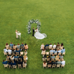 Drone video top view of the wedding ceremony in a green field